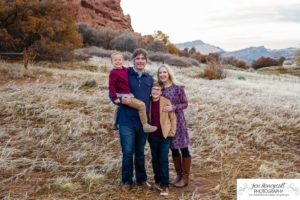 Littleton family photographer in Colorado South Valley Open Space park Ken Caryl red rocks rock formations boys brothers fall photo session cold frost winter mother father sons sunset photography