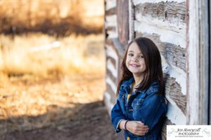 Littleton family photographer Hildebrand Ranch Colorado farm barn boy girl siblings brother sister mother father sunset golden natural light photography foothills view children kids broken arm