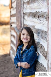 Littleton family photographer Hildebrand Ranch Colorado farm barn boy girl siblings brother sister mother father sunset golden natural light photography foothills view children kids broken arm