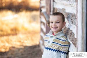 Littleton family photographer Hildebrand Ranch Colorado farm barn boy girl siblings brother sister mother father sunset golden natural light photography foothills view children kids broken arm