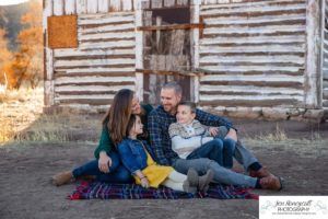 Littleton family photographer Hildebrand Ranch Colorado farm barn boy girl siblings brother sister mother father sunset golden natural light photography foothills view children kids broken arm