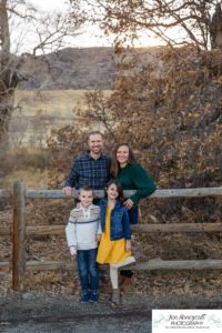 Littleton family photographer Hildebrand Ranch Colorado farm barn boy girl siblings brother sister mother father sunset golden natural light photography foothills view children kids broken arm