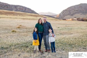 Littleton family photographer Hildebrand Ranch Colorado farm barn boy girl siblings brother sister mother father sunset golden natural light photography foothills view children kids broken arm