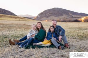 Littleton family photographer Hildebrand Ranch Colorado farm barn boy girl siblings brother sister mother father sunset golden natural light photography foothills view children kids broken arm