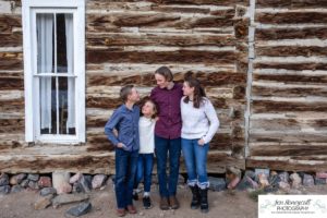 Littleton family photographer Clear Creek History park Golden Colorado snow winter big kids children siblings bridge Christmas cute fun barns sunset photography