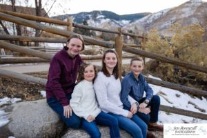 Littleton family photographer Clear Creek History park Golden Colorado snow winter big kids children siblings bridge Christmas cute fun barns sunset photography