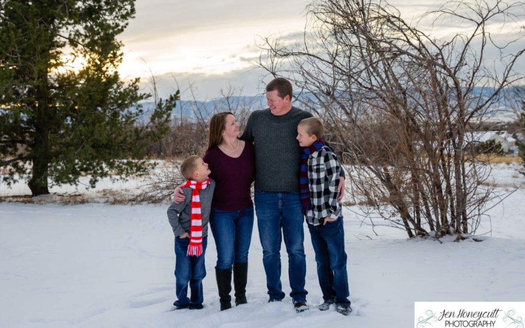 The {R} family of 4 in the snow at the Highlands Ranch Mansion by Littleton photographer