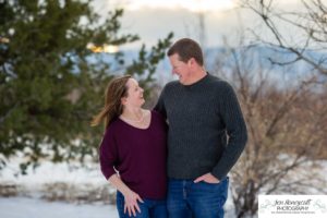 Littleton family photographer in Colorado at the Highlands Ranch Mansion in the snow boys brothers Christmas winter stone building iron gate