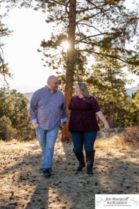 Littleton engagement photographer Mt. Falcon in love husband wife engaged mr. and mrs. mountains Colorado April wedding future marriage married diamond ring photography sunset