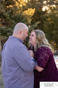 Littleton engagement photographer Mt. Falcon in love husband wife engaged mr. and mrs. mountains Colorado April wedding future marriage married diamond ring photography sunset fun laughter