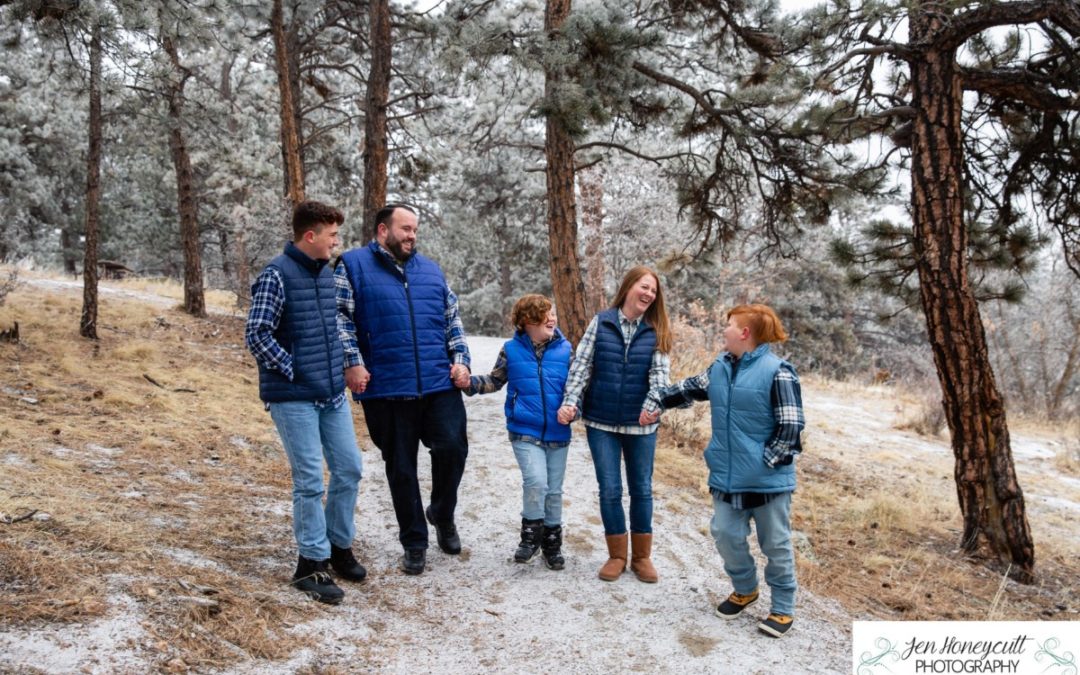 The {R} family of 5 at Mt. Falcon park for family photos in below zero temps by Littleton photographer