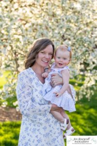 Littleton family photographer pink and white crab apple tree blossoms spring Denver brother sister mother father expecting baby bump little big sunset daughter son mother's day photo session