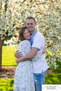 Littleton family photographer pink and white crab apple tree blossoms spring Denver brother sister mother father expecting baby bump little big sunset daughter son mother's day photo session