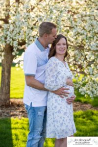 Littleton family photographer pink and white crab apple tree blossoms spring Denver brother sister mother father expecting baby bump little big sunset daughter son mother's day photo session