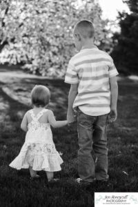 Littleton family photographer pink and white crab apple tree blossoms spring Denver brother sister mother father expecting baby bump little big sunset daughter son mother's day photo session