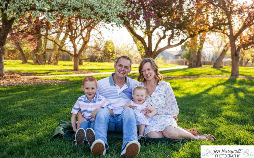 The {S} family of 4 1/2 in the pink and white tree blossoms by Littleton photographer [spring photo session in Colorado]