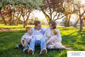 Littleton family photographer pink and white crab apple tree blossoms spring Denver brother sister mother father expecting baby bump little big sunset daughter son mother's day photo session