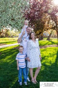 Littleton family photographer pink and white crab apple tree blossoms spring Denver brother sister mother father expecting baby bump little big sunset daughter son mother's day photo session