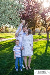 Littleton family photographer pink and white crab apple tree blossoms spring Denver brother sister mother father expecting baby bump little big sunset daughter son mother's day photo session