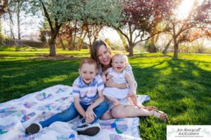 Littleton family photographer pink and white crab apple tree blossoms spring Denver brother sister mother father expecting baby bump little big sunset daughter son mother's day photo session