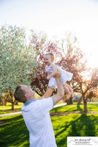 Littleton family photographer pink and white crab apple tree blossoms spring Denver brother sister mother father expecting baby bump little big sunset daughter son mother's day photo session