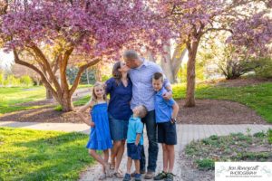 Littleton family photographer Bemis tree blossoms pink and white trees grandchildren grandparents visiting Colorado sons daughter mother father sunset light