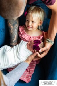 Littleton baby newborn photographer Colorado in home lifestyle sisters mother father daughter natural light connection tiny infant photography