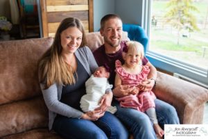 Littleton baby newborn photographer Colorado in home lifestyle sisters mother father daughter natural light connection tiny infant photography