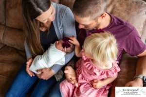 Littleton baby newborn photographer Colorado in home lifestyle sisters mother father daughter natural light connection tiny infant photography