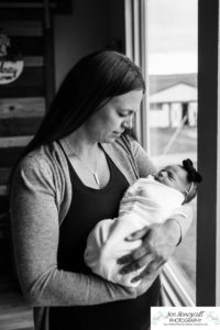 Littleton baby newborn photographer Colorado in home lifestyle sisters mother father daughter natural light connection tiny infant photography