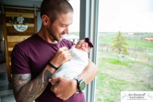 Littleton baby newborn photographer Colorado in home lifestyle sisters mother father daughter natural light connection tiny infant photography