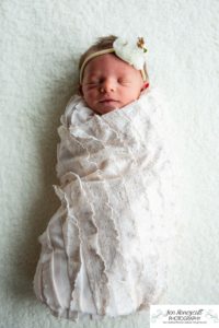 Littleton baby newborn photographer Colorado in home lifestyle sisters mother father daughter natural light connection tiny infant photography