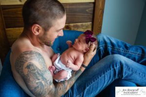 Littleton baby newborn photographer Colorado in home lifestyle sisters mother father daughter natural light connection tiny infant photography