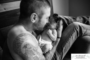 Littleton baby newborn photographer Colorado in home lifestyle sisters mother father daughter natural light connection tiny infant photography