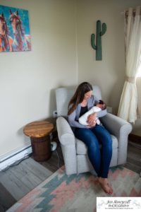 Littleton baby newborn photographer Colorado in home lifestyle sisters mother father daughter natural light connection tiny infant photography