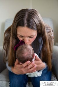 Littleton baby newborn photographer Colorado in home lifestyle sisters mother father daughter natural light connection tiny infant photography