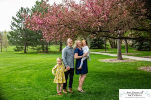 Littleton family photographer Denver Colorado spring crab apple tree blossoms little girls mother father daughter sisters