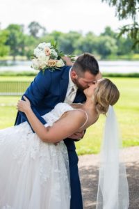 Littleton wedding photographer Catholic mass ceremony bride and groom married marriage dress bridesmaids groomsmen summer hot beautiful Wash Park dip veil priest Wellshire Event Center