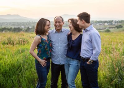 Littleton family photographer extended grandparents grandson mini photo session adult children sunset light dogs visiting Colorado from out of state baby boy parenthood one month old newborn photography outdoors