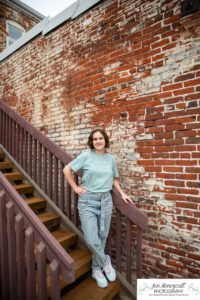 Littleton high school senior photographer in Colorado Historic Downtown urban setting Ralston Valley Arvada Class of 2022 brick walls sunflowers sunset natural light photography teen girl