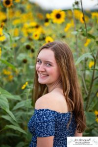 Littleton high school senior photographer Heritage cross country Writer's Vista park Carson Nature Center sunflowers lovely girl sunset light bridge friend