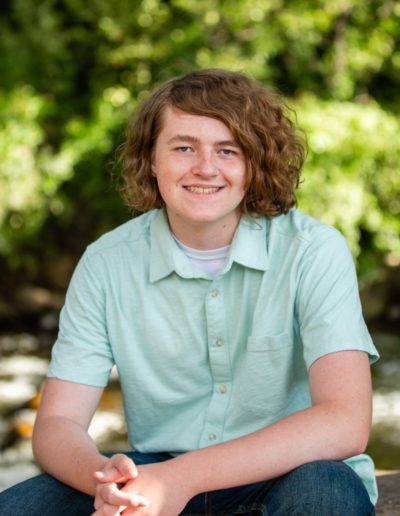 Littleton high school senior photographer Stem graduate Class of 2022 soccer player boy Red Rocks Morrison sunset light