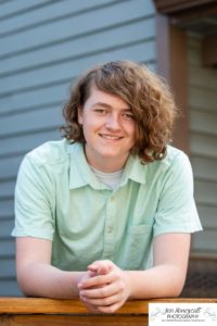 Littleton high school senior photographer Stem graduate Class of 2022 soccer player boy Red Rocks Morrison sunset light