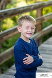 Littleton family photographer at Writer's Vista park in Colorado boy brothers bridge new client fun morning natural light leaves yellow trees