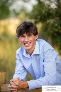 Littleton high school senior photographer in Colorado Chatfield Class of 2022 basketball player smart boy Hildebrand Ranch sunset fall photo session