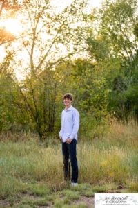 Littleton high school senior photographer in Colorado Chatfield Class of 2022 basketball player smart boy Hildebrand Ranch sunset fall photo session