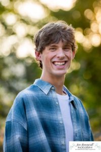 Littleton high school senior photographer in Colorado Chatfield Class of 2022 basketball player smart boy Hildebrand Ranch sunset fall photo session