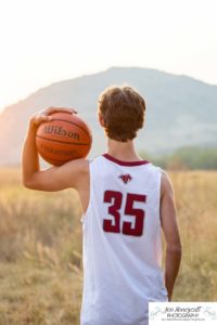 Littleton high school senior photographer in Colorado Chatfield Class of 2022 basketball player smart boy Hildebrand Ranch sunset fall photo session