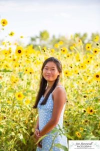 Littleton high school senior photographer Arapahoe Centennial Colorado Carson Nature Center Class of 2022 summer light sunset sunflowers beautiful girl natural light photography