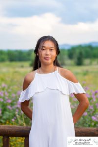 Littleton high school senior photographer Arapahoe Centennial Colorado Carson Nature Center Class of 2022 summer light sunset sunflowers beautiful girl natural light photography